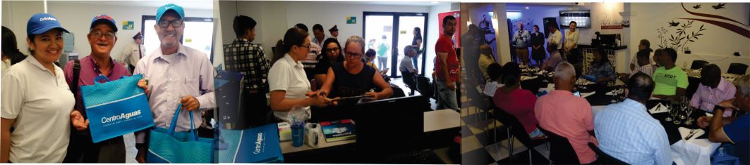 Tres fotografías de la celebración donde se pueden ver a funcionarios de la empresa repartiendo detalles a los usuarios. Así mismo, los vocales de control compartiendo una cena 